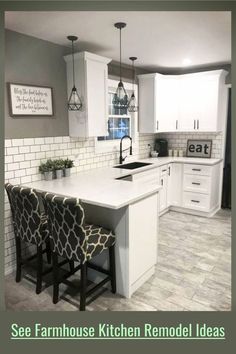 a kitchen with white cabinets and gray tile flooring