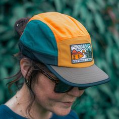 Retro styling with modern performance in a 100% recycled construction. A lightweight, breathable 5 panel cap for the outdoors, however you like to enjoy them. The Out There Trail Cap is your partner for performance and protection across three seasons of running, riding, camping and climbing - styled for when the trails end in café or pub.A soft, pliable brim can be adjusted to your preference, while the adjustable closure accommodates all head sizes. Inside is a moisture-wicking, anti-bacterial Six-panel Outdoor Baseball Cap, Functional 5-panel Baseball Cap For Outdoor, Outdoor 5-panel Baseball Cap, Breathable 5-panel Baseball Cap For Camping, Outdoor Trucker Baseball Cap 5-panel, Sunlit Forest, Cap Outfit, Biodegradable Packaging, 6 Panel Cap