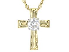 Moissanite Fire(R) .80ct diamond equivalent weight round, 14k yellow gold over sterling silver   cross pendant and 18-inch Singapore chain. White rhodium settings. Measures approximately 3/4" L x 9/16" W. Chain has a 2-inch extender and a lobster clasp. Actual moissanite weight is .68ct. Yellow Gold Crucifix Jewelry With Cubic Zirconia, Yellow Gold Cubic Zirconia Crucifix Jewelry, Yellow Gold Cubic Zirconia Cross Pendant, Gold Necklace With Round Center Stone, Gold Round Necklace With Center Stone, Fine Jewelry Crucifix With Diamond Accents, Diamond White Cubic Zirconia Cross Necklace, Gold Cross Necklace With Prong Setting, White Brilliant Cut Crucifix Jewelry