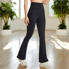 Elevate your athleisure look with these Anna-Kaci Women's High Waist Flare Leggings. Featuring a flattering high-waisted fit, these leggings provide ultimate comfort and support throughout your day. The flare leg design adds a stylish twist to the classic legging silhouette, making them perfect for yoga sessions, casual outings, or relaxing at home. Made from a soft, stretchy fabric, these leggings offer flexibility and breathability, ensuring a comfortable wear for any activity. Pair them with Sporty Black High-cut Leg Pants, Casual Full-length Compression Yoga Pants, High Rise Black Bottoms For Pilates, Mid-rise Black Pants For Pilates, Black Mid-rise Pants For Pilates, Casual Mid-rise Moisture-wicking Leggings, Black Mid-rise Bottoms For Pilates, Casual Compression Yoga Pants, Casual Mid-rise Compression Yoga Pants