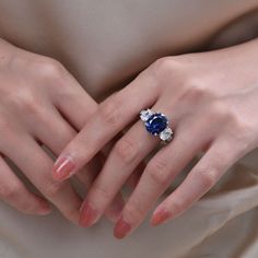 a woman's hand with a ring on it