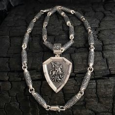 Silver set. 1️⃣Silver cast chain Art. 0206B ✔️Silver 925 with blackening ✔️Weight 150 grams ✔️Length 60 cm/ 23,6 inches ✔️Width 6.5mm ✔️Carabiner lock 2️⃣ Silver pendant - shield of St. George the Victorious with prayer ✔️Silver 925 + blackening ✔️Weight 32 grams (+- 1 gram) ✔️Size 58/34 mm (including lug) ✔️Thickness 4 mm ✔️Possible production in: 🟡Gold 14K or 18K (red, yellow, white) 🌕24K gold plated sterling silver 🔘Silver with blackening or rhodium (shown in photo) Medieval Sterling Silver Necklace In Silver, Medieval Style Silver Engraved Necklace, Chain Art, Claw Necklace, Chain Accessories, St George, Gold Plated Sterling Silver, Silver 925, Chains Necklace