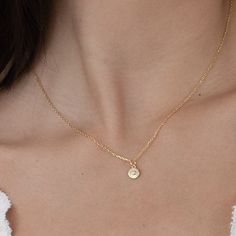 add a classic touch to your everyday style with our 'until I found you necklace'. this dainty, dreamy piece is perfect for everyday layering and the perfect accessory for any occasion - from a casual brunch with friends to a formal meeting. its timeless design ensures it will remain a staple in your wardrobe for years to come. demi-fine 18k gold or rhodium over sterling silver 15" long with a 2" extender chain is 1mm thick pendant is 6mm round Delicate Everyday Charm Necklace With Initial Pendant, Delicate Everyday Charm Necklaces With Initial Pendant, Dainty Charm Necklaces With Initial Pendant For Everyday, Everyday Tiny Initial Pendant Charm Necklace, Simple Everyday Necklace With Delicate Chain, Simple Everyday Initial Pendant Necklace, Dainty Everyday Jewelry With Initial Pendant, Everyday Pendant Initial Necklace With Delicate Chain, Dainty Initial Pendant Necklace For Everyday