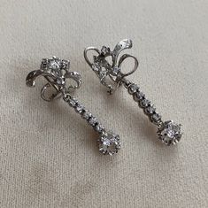 These are beautiful Mid Century 10k white gold, tested, unmarked earrings with prong set Clear Spinels. These are so beautiful on and have lots of movement and sparkle. All gems are tested with a presidium gem tester. 1.5" L 2.8g each Shipments are made on Wednesdays*  Please ask if you need it shipped sooner. Will only ship to Etsy listed address. Sorry, I do NOT ship International. All sales are final, please message me for more photos or information White Gold Sterling Silver Clip-on Diamond Earrings, White Gold Clip-on Diamond Earrings In Sterling Silver, Vintage Diamond Clip-on Earrings, Silver Diamond Clip-on Earrings, Silver Clip-on Diamond Earrings, Vintage Platinum Earrings, Classic Silver Diamond Clip-on Earrings, Silver Platinum Earrings With 17 Jewels, Vintage Platinum Diamond Earrings For Wedding