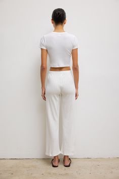 Cut in our anything but basic Kelly Cotton Rib, The Kelly Crop Slim Fit Tee is the perfect high waist pant companion. Featuring a crew neckline, a just right cropped length, and clean, tailored finishing. Shop all styles in this fabric group Cotton Cropped Top For Loungewear, Cropped Bottoms With Elastic Waistband For Loungewear, Spring Cropped Loungewear Pants, Cropped Pants For Spring Loungewear, Cropped Loungewear Pants For Spring, Cotton Crop Top With Elastic Waistband, White Cropped T-shirt For Spring Loungewear, Spring Cropped Hem Cotton Bottoms, Spring Cotton Cropped Hem Bottoms