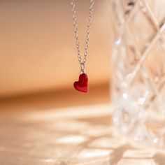 Let your big heart be showcased with our dainty Red Heart Necklace. The cherry red heart charm is minimalist and perfect for layering with any other chains in your collection. This charm necklace is a trendy yet everyday design to throw on and add brightness to a simple outfit. Material: High Quality Solid 925 Sterling Silver Finish: Sterling Silver ∙ 18K Gold Featuring a ~8 x 6mm Red Enamel Heart Charm with minimalist cable chain adjustable 16 inches to 18 inches SKU: RR-NR141 Aquamarine Stacking Ring, Red Heart Necklace, Duo Beads, Pearl Anklet, Stacking Ring Set, Simple Outfit, Beaded Anklets, Teardrop Necklace, Chain Anklet