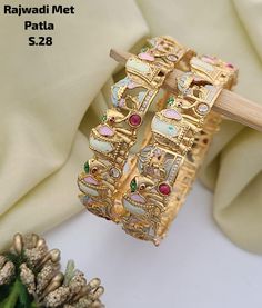 Description :- Gold plated Polki bangle pair/Statement Kada/Kundan Bangles/Bridal Bangle/Indian Wedding/Pakistani/Punjabi Gold Kada bangles /Indian bangles/Antique bangles/Temple Jewelry/Bridal Bangles/Indian Wedding/Pakistani Jewelry/South indian jewelry Gift yourself a royal look with this perfectly crafted necklace set from Manalisstudio. Crafted with high quality stones and pearls, it is impressive in design. The green enamel artwork adds perfect texture to the design. Perfect for weddings a Luxury Meenakari Bangle Bracelet, Luxury Yellow Bangle For Festivals, Luxury Round Bangle For Wedding, Luxury Traditional Meenakari Bracelets, Luxury Victorian Bangle For Wedding, Luxury Multicolor Bangle For Festive Occasions, Luxury Handmade Bangle For Festive Occasions, Gold Kundan Bracelet, Kundan Kada Design