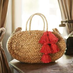 Adorable oval woven beach straw bag made by artisans in Bali in natural round shape. Sourced directly from artisans and hand-finished in our studio in La Jolla, California. Bag Details : • Dimension : around W 13 x H 8 inches • Depth : around 3 inches • Material : woven dried grass from Java• Lined Fuschia Pink Color, La Jolla California, Straw Beach Bag, Fuschia Pink, Straw Tote Bag, Bag Details, Pink Tassel, Woven Tote Bag, Straw Bags