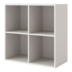 a white shelf unit with four compartments