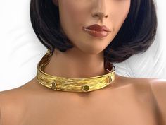 Immerse yourself in the timeless allure of ancient Egypt with our Handmade Gold Plated Open Choker Collar Necklace. Inspired by the opulence of this ancient civilization, this stunning piece combines modern design with traditional elements for a truly captivating accessory. Crafted with meticulous attention to detail, this choker features vibrant colorful crystals that add a pop of color and sparkle to your ensemble. The open collar design enhances its contemporary appeal, making it a statement Elegant Adjustable Choker For Ceremonial Occasions, Bohemian Gold Gemstone Choker, Gold Gemstone Bohemian Choker, Gold Bohemian Choker With Gemstone, Artisan Gold Choker Necklace, Elegant Gold Gemstone Choker, Adjustable Gold Artisan Choker, Adjustable Artisan Gold Choker, Artisan Adjustable Gold Choker