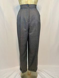 "Vintage gray tweed trousers by HW New York. Wide straight legged pants with a dark gray tweed. Pants have sewn cuff, darts at waist, front side pockets, and a functional back pocket that buttons. There is also a sleek black lining inside the pants. Closures are two buttons and zipper at waist. Dress up for the office or dress down for a chic streetwear look! There are no tears, stains, holes, or snags as far as I can tell. Excellent condition!  Brand is HW New York (best guess is Hawksley & Wight clothing company, but not 100% certain) and the size is a women's size 10. Please check my measurementsto compare to your own for accurate sizing! Materials used are 100% wool and 100% polyester for the inside lining. Made in Guatemala. Care instructions suggest to dry clean only. Measurements: 2 Fitted Tweed Bottoms For Office, Classic Gray High-waisted Dress Pants, Gray High Waist Pants For Formal Occasion, Classic Tweed Pants For Work, Classic Gray High-waisted Pants, Classic Gray Wool Bottoms, Classic Long Gray Pants, Classic High Waist Gray Bottoms, Gray Formal Bottoms For Fall