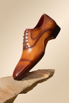 Fitted Brown Leather Shoes With Snip Toe, Luxury Cognac Oxfords With Cap Toe, Fitted Brown Leather Shoes With Leather Sole, Luxury Cognac Cap Toe Oxfords, Timeless Italian Cap Toe Leather Shoes, Fitted Cognac Oxfords With Leather Sole, Luxury Fitted Leather Shoes With Plain Toe, Luxury Cognac Cap Toe Dress Shoes, Timeless Leather Shoes With Stitched Sole And Almond Toe