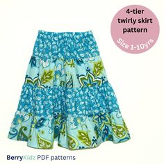 a blue skirt with flowers on it and the words, 4 - tiered twirly