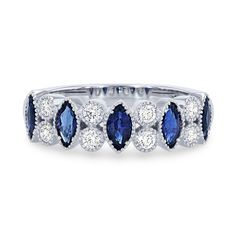 This band features alternating blue sapphires totaling 0.74 carats and round brilliant cut diamonds totaling 0.23 carats. Milgrain detail frames the bezel setting for a vintage touch. Classic Sapphire Diamond Ring With Bezel Setting, Blue Sapphire Wedding Band, Bezel Band, Vintage Sapphire Ring, Diamonds Direct, Sapphire Wedding Band, Womens Wedding Bands, Round Brilliant Cut Diamond, Bezel Setting