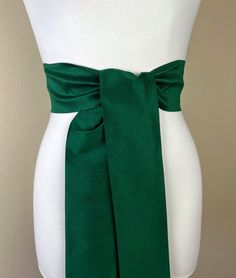 "Wide Textured Alpine Green Sash Belt  Green Dupioni Sash  Dark Green Dress Sash  Dupioni Belt  Green Wedding & Bridesmaid Sash  Satin Swank  Add rich color and texture to your special occasion outfit with this Satin Swank® dupioni sash belt. Depending on your waist size and the length you choose (75 and 90 inch lengths available), you can wrap this sash around your waist once or twice. You decide whether to tie the sash in a bow or a simple knot with long-hanging tails. Tie in front, in back, or on the side. A double layer of textured dupioni fabric in Alpine green. Sash is the same front and back with seams hidden within the fold lines and ends finished on the angle. Dupioni features a rustic weave with naturally occurring slubs running throughout the fabric resulting in exquisite depth, Fitted Bridesmaid Sash, Formal Fitted Sash With Tie Back, Formal Fitted Sash With Tie Waist, Elegant Fitted Tie-waist Sash, Elegant Fitted Tie Waist Sash, Elegant Fitted Green Sashes, Fitted Tie Back Sash For Evening, Fitted Evening Sash With Tie Back, Witch Oc