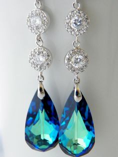 Peacock Wedding Earrings Long Blue Wedding by EstyloJewelry Formal Blue Crystal Earrings, Elegant Blue Crystal Wedding Earrings, Elegant Blue Crystal Earrings For Wedding, Blue Sterling Silver Chandelier Earrings For Wedding, Blue Sparkling Dangle Earrings, Dazzling Blue Crystal Earrings, Dazzling Sapphire Earrings For Wedding, Blue Cubic Zirconia Chandelier Earrings For Party, Blue Dangle Earrings With Sparkling Stones