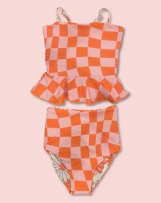 This darling tankini is basically four swimsuits in one (see the variations below). We tested the fabrics in the salty ocean, sandy beaches, pools, and hot-tubs. It is high-quality, comfortable, and SO much fun!! Truly, a combination your littles won't want to live (or swim) without ;). High-waisted reversible bottoms Peplum top Adjustable back straps High-quality double fabric Fits true-to-size Crochet Tankini, Cute One Piece Swimsuits, Printed Peplum Top, Swimming Suits, Girls Swimwear, Swimming Swimsuit, Modest Swimsuits, Floral One Piece, Tankini Set