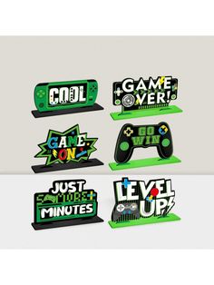 four video game coasters with the words cool and games over on them in different colors