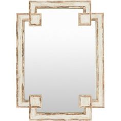 a white and gold mirror on a wall