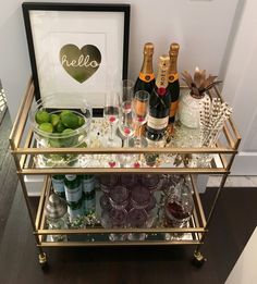 a bar cart filled with bottles and glasses