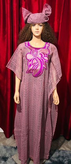 This stunning long dress with camiso for party is a must-have for any fashion-forward woman. Made from high-quality dry lace material, this dress features intricate embroidery that adds a touch of elegance to the already beautiful design. The dress comes in a vibrant pink colour that perfectly complements the traditional Nigerian/African style. The dress is one size regular and is suitable for women of all shapes and sizes. It is perfect for any occasion, whether you are attending a party, a wed Lace Patchwork Evening Dress, Floor-length Lace Gown With Lace Patchwork, Evening Kaftan With Floral Embroidery, Elegant Fitted Maxi Dress With Chikankari Embroidery, Floor-length Lace Dresses For Spring, Long Sleeve Lace Maxi Dress With Lace Work, Elegant Purple Gown With Floral Embroidery, Party Floor-length Kaftan With Floral Embroidery, Traditional Floor-length Dress With Lace Work