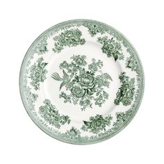 an ornate green and white plate with flowers on the rim, against a white background