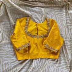 Hand embroidered ready made saree blouse / crop top/stitched saree blouse usa / yellow saree blouse/modern blouse/zardosi blouse/shirt sleeve saree blouse/ pure silk blouse/ maggam work blouse            Well..!! we understand that you may not get in your desired size/pattern, here you go with customization according to your size/pattern which we can deliver in 1-2 weeks of time period !!      Here is a beautiful Hand embroidered zardosi work crop top / blouse in yellow color that has broad neck Yellow Saree Pink Blouse Maggam Work Designs, Cheap Blouse With Resham Embroidery, Cheap Resham Embroidery Blouse For Puja, Fancy Blouses For Pattu Sarees, Yellow Blouse Work Designs, Yellow Saree Blouse Design, Yellow Maggam Work Blouse Designs, Yellow Blouse Design Embroidery, Mustard Yellow Blouse Designs