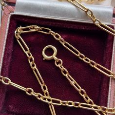 A beautiful and versatile long antique chain crafted in 15ct yellow gold, comprised of three oval links then an elongated link, fastened with a bolt ring clasp. The length of this chain makes it great for layering with other necklaces! Circa 1910-1920. Stamped "15C" for 15ct gold. The chain measures approximately 800mm (L) x 3.4mm (W). The approximate weight is 20.0 grams. Please note that the antique box pictured is for display purpose only. Thank you. CONDITION: In very good antique condition, Vintage Yellow Gold Chain Necklace With Rectangular Links, Yellow Gold Figaro Chain Necklace With Oval Links, Classic Gold Chain Necklace With Hooks And Links, Antique Yellow Gold Link Chain Necklace, Antique Yellow Gold Chain Link Necklace, Yellow Gold Oval Link Chain Necklace With Hooks, Formal Oval Figaro Chain Necklace, Classic Oval Link Chain Necklace With Hook And Links, Bolt Ring