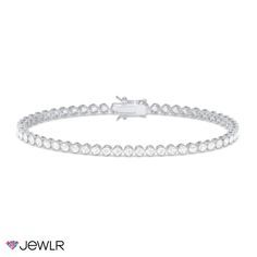 Add a touch of sparkle to any look with this beautiful tennis bracelet showcasing a full band of round premium cubic zirconias. The 2mm bezel-set stones are set continuously across the box-catch closure for a seamless design. This 7" bracelet is available in sterling silver or 18K gold-plated silver and includes a safety latch on the box-catch closure for peace of mind. Gold Plated Silver, Tennis Bracelet, Bezel Setting, Peace Of Mind, Cubic Zirconia, 18k Gold, Tennis, Sparkle, Band