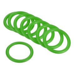 green rubber o - rings on a white background