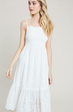 From beach days to a village stroll, all eyes will be on you in the adorable Summer Sun White Smocked Midi Dress! Adjustable tank straps top this sweet midi made from ivory white lightweight woven fabric. A square neckline and stretchy smocked bodice top a flowy midi skirt with an eyelet lace ruffle hem. DETAILS & CARE Cotton. Dry Clean. Imported. ORDERS, SHIPPING & RETURNS Orders, Shipping, & Returns Affordable White Smocked Dress, White Sun Dress Midi Boho, Cute White Smocked Dress Affordable, Cheap Sleeveless Smock Sundress, Affordable Smocked Sundress For Summer, Affordable Summer Midi Dress With Smocked Bodice, Cheap Sundress With Smocked Back For Brunch, Cheap White Sundress For Play, Luxury Fitted Smocked Midi Dress