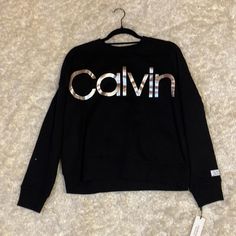 Calvin Klein Pull Over Sweatshirt Color Is Black, Size Is Large, Brand New With Tags. Silver Long Sleeve Casual Sweatshirt, Casual Long Sleeve Metallic Top, Silver Crew Neck Top For Fall, Calvin Klein Clothing, Calvin Klein Outfits, Calvin Klein Sweatshirt, Clavin Klein, Sweatshirt Women, Womens Calvin Klein