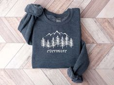 The Evermore Embroidered Sweatshirt 2D Crewneck Sweatshirt is the perfect gift for your family, designed to bring warmth, comfort, and style into their lives. This exquisite sweatshirt, with its intricately embroidered design, is a true work of art that will surely impress your loved ones. One of the standout features of this sweatshirt is the attention to detail in the embroidery. Crafted with precision and care, the intricate design adds a touch of elegance and sophistication to the overall lo Winter Fleece Tops With Embroidered Graphics, Casual Embroidered Winter T-shirt, Winter Relaxed Fit Tops With Embroidered Graphics, Embroidered Winter Sweatshirt For Everyday, Winter Loungewear Tops With Embroidered Graphics, Winter Embroidered Tops For Loungewear, Winter Sweatshirt With Embroidered Graphics For Loungewear, Winter Embroidered Graphic Sweatshirt For Loungewear, Winter Loungewear Sweatshirt With Embroidered Graphics