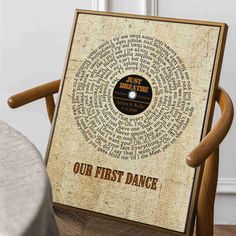 an old record with the words our first dance printed on it, sitting in a chair