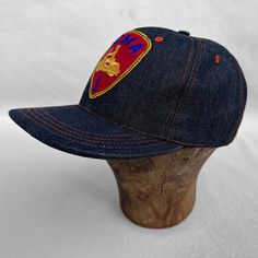 Our MF® Snapback Cap is a six panel pattern, in classic 1970s “trucker hat” fashion, an obvious choice to match our FW2020 mfsc TRUCK STOP story. It features a lower profile, closer to a baseball cap, classic US Navy ship hat or “dad’s hat” vibe. SPECS Six Panel Model: Full denim.Fabric: NOS Cone Mills 12 Oz. denim twill, white/pink line selvedge ID, milled in USA. * An original Mister Freedom® design inspired by vintage 1970s “trucker” hats, baseball caps, US Navy ship caps and other classic pr Retro Six-panel Snapback Hat, Streetwear Six-panel Trucker Hat, Vintage Six-panel Snapback Hat With Logo Patch, Streetwear Trucker Baseball Cap, Vintage Six-panel Baseball Cap With Logo Patch, Vintage Pre-washed Snapback Baseball Cap, Vintage Six-panel Baseball Cap For Streetwear, Vintage Pre-washed Snapback Hat, Vintage Snapback Hat With Curved Brim And Logo Patch