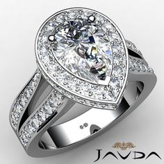 a pear shaped diamond engagement ring set with pave diamonds on the band and shoulders