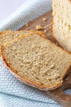 a loaf of bread sitting on top of a wooden cutting board