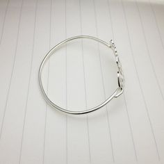 "All of our products are handmade. This initial monogram bracelet is made out of solid sterling silver monogram about 1.5\" /38mm width and 1.2mm thickness. The bangle size can be selected in 5.5\",6\",6.5\",7\" and 7.5\". You choose the letters and I create your unique monogram. It can be your initials (usually with the family name in the center), or the initials of those most special to you. Please let me know upon checkout in 'notes to seller': NOTE For traditional monograms LAST name initial Silver Monogram Bracelet, Unique Monogram, Monogram Bracelet, Bracelet Christmas, Silver Monogram, Custom Bracelet, Initial Monogram, Bridesmaids Personalized, Name Bracelet