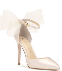 From Jessica Simpson&#x2C; the Phindies Oversized Tulle Bow Dress Pumps feature:Fabric upperOversized tulle bow on the backAnkle strap with buckle closureSynthetic liningSynthetic outsoleApprox. 3.54" heel heightImported. Homecoming Heels, Bow Back Dress, Elegant Wedding Shoes, Blush Heels, 2025 Wedding, Tulle Bow, Bow Wedding Dress, Jessica Simpson Heels, Tulle Bows