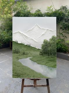 four different views of the same area with trees, bushes and mountains in them are shown