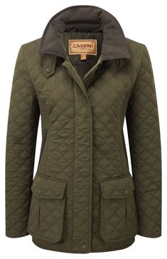 Schoffel - Women's Lilymere Quilt Jacket -Olive Perfect for seasonal days spent out shooting, the Lilymere Quilt Jacket is a timeless classic. This piece is composed of remarkably durable polyester fabric with a water-repellent coating for optimum comfort, an easy drape over the skin, and maximum all-weather protection. The inside zip pockets offer the perfect spot for storing small valuables on the go. The two-way YKK® zip allows quick ventilation and makes for easy wearing. Incredibly lightweight, versatile, and effortlessly stylish, this women’s jacket is finished with Schöffel’s signature brown trim for a premium look. After a long, muddy day out, simply pop your jacket on a low machine setting for clean wear. Product code 20-5057-6670 Features Water-repellent 100% polyester Quilt fabr Field Coat, Quarter Zip Fleece, British Outfits, Quilt Jacket, Brown Trim, Jacket For Women, Casual Blazer, Long Hoodie