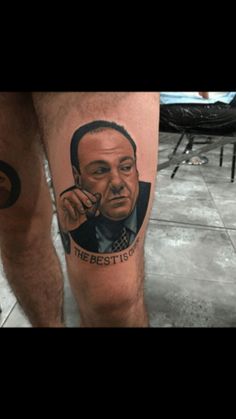 a man with a tattoo on his leg that says the best is yet to him