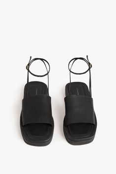 DescriptionWith its flat, chunky shape and a sole made from leather and EVA to create different layers and textures, the Frances Sandal is, in VB's words, an 'exaggerated hotel pool slide'. It features a squared toe and cross-over minimalist leather band with waxed, raw edges that channel the laidback feel of the 90s, while a stitched, slightly padded in-sock and adjustable ankle strap, hand-stitched to the cross-over band, provide comfort and practicality.Product Details Chunky Sole Flat Sandal Chunky Flats, Pool Slide, Hotel Pool, Toes Designs, Toe Designs, The 90s, Leather Band, Snake Print, Victoria Beckham