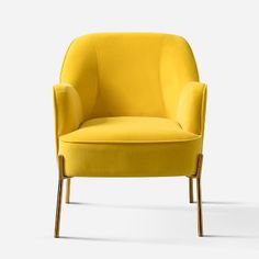 a yellow chair sitting on top of a white floor