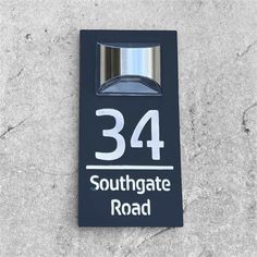 a sign on the side of a building that says,'34 southgate road '