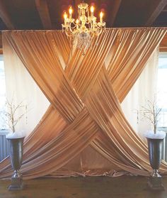 an image of a stage set up with chandelier and drapes on it