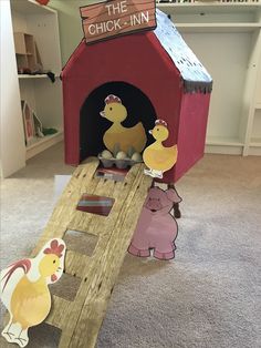 the chicken - inn is made out of cardboard and cutouts to look like farm animals