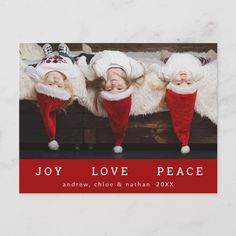 three little kids wearing christmas hats and red pants with the words joy love peace on them