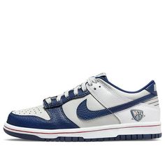 Nike's Dunk Low GS is a must-have sneaker for any big kid. This shoe celebrates the NBA's 75th anniversary with a Nets-inspired color scheme, complete with tumbled leather overlays in white and Blue Void. The lateral heel graphic nods to the franchise's current home in Brooklyn, while unique branding elements include a tongue tag with the 75th anniversary logo and a diamond-etched lace dubrae. The red stitching on the white midsole adds a pop of contrast, while the navy rubber outsole provides support and durability. (SNKR/Retro/Skate/Casual/Low Top/Brooklyn Nets) Nike Casual Basketball Sneakers, Throwback High-top Basketball Sneakers, Collegiate Nike Low-top Basketball Shoes, Nike Collegiate Low-top Basketball Shoes, Nike Throwback Basketball Shoes With Round Toe, Nike Low-top Throwback Basketball Shoes, Nike Throwback Low-top Basketball Shoes, Nike Collegiate Sneakers For Streetwear, Nike Lace-up Sneakers For Sports Events