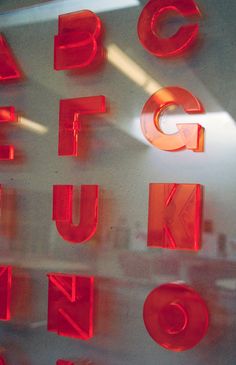 the letters are made up of glass and have red lights on them to light up the room